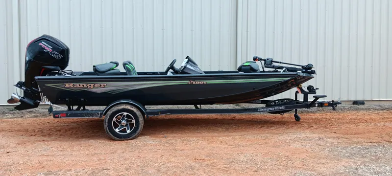 Slide: The Image of 2025 Ranger RT188C boat on trailer, side view, parked outdoors. - 0