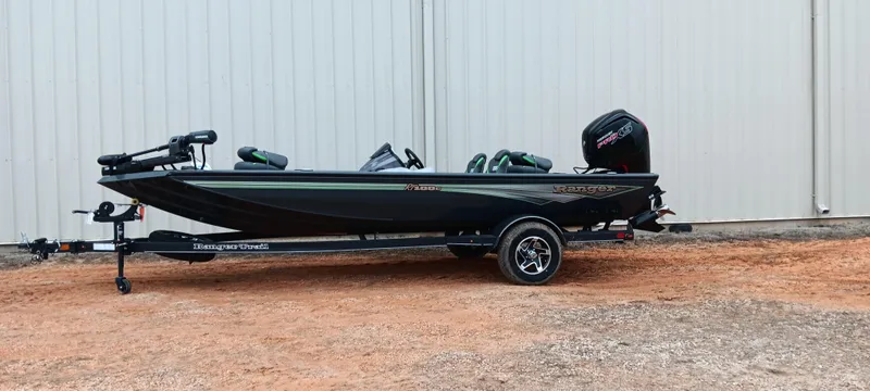 Slide: The Image of 2025 Ranger RT188C fishing boat on trailer, parked outdoors. - 1