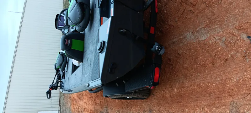 Slide: The Image of 2025 Ranger RT188C boat on a dirt surface, showcasing sleek design and modern features. - 11