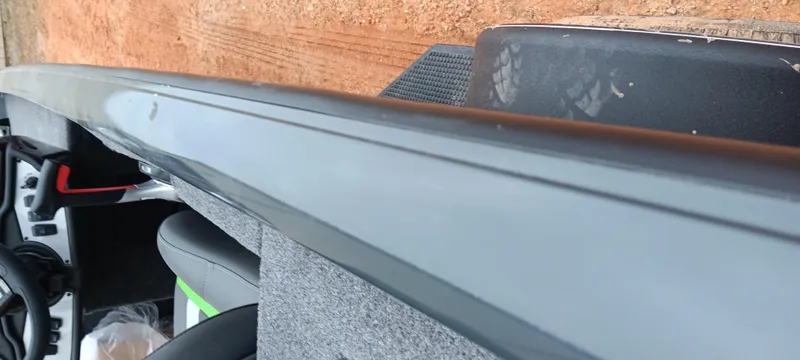 Slide: The Image of 2025 Ranger RT188C boat interior with gray upholstery and sleek design. - 13