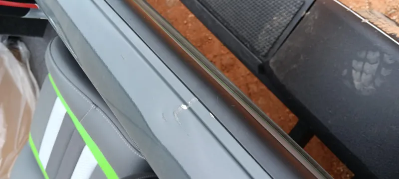 Slide: The Image of 2025 Ranger RT188C boat interior with minor scratch on the side panel. - 14