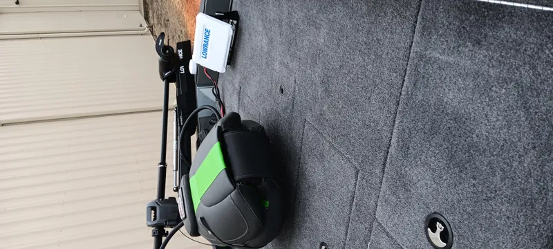 Slide: The Image of 2025 Ranger RT188C boat deck with fishing equipment and Lowrance device. - 16