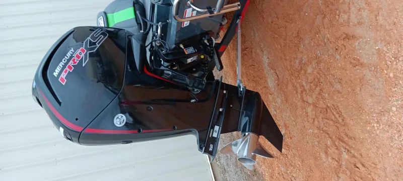 Slide: The Image of 2025 Ranger RT188C boat with Mercury Pro XS outboard motor on a dirt surface. - 9