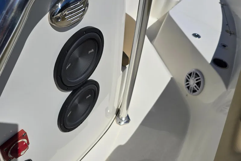 Slide: The Image of 2019 Key West 203 FS boat interior with audio speakers and stainless steel railing. - 14