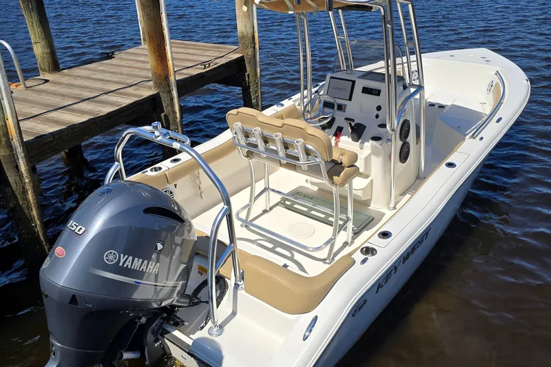 Slide: The Image of 2019 Key West 203 FS boat docked, featuring Yamaha outboard motor. - 15