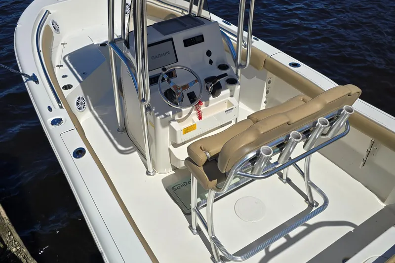 Slide: The Image of 2019 Key West 203 FS boat interior with steering console and seating. - 16