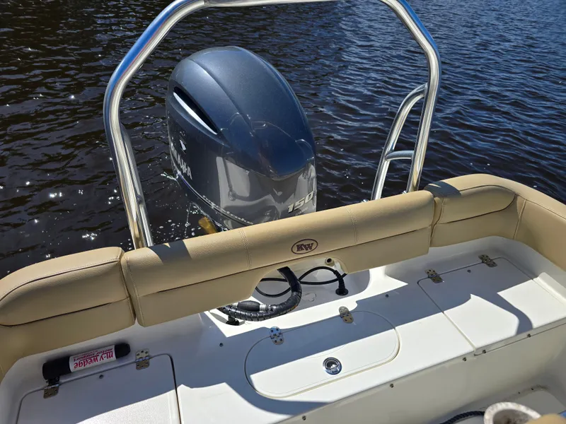 Slide: The Image of 2019 Key West 203 FS boat with outboard motor on water. - 6