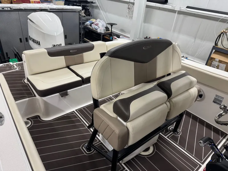 Slide: The Image of 2019 Robalo R242 Explorer boat interior with Yamaha engine, featuring cushioned seating and modern design. - 12