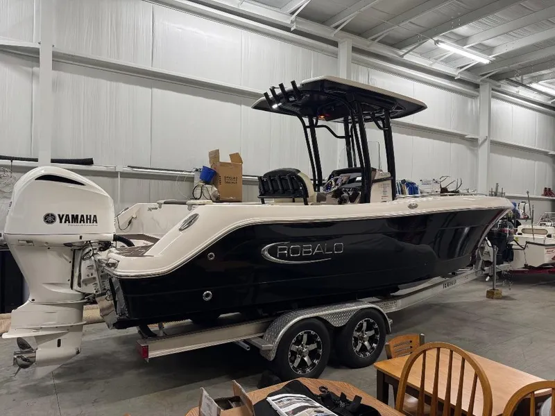 Slide: The Image of 2019 Robalo R242 Explorer boat with Yamaha engine in indoor storage. - 3