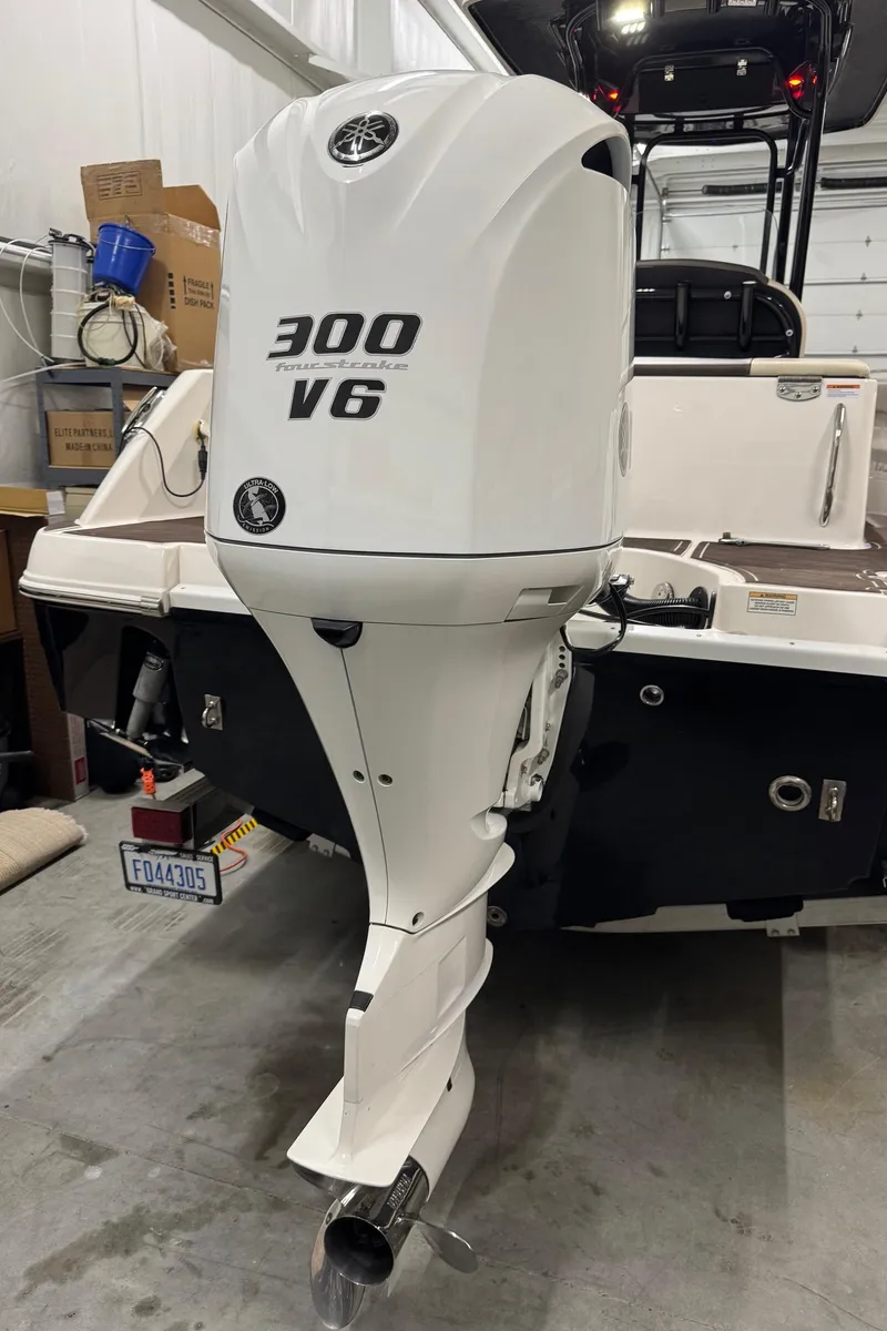 Slide: The Image of 2019 Robalo R242 Explorer with 300 V6 engine in a garage. - 5