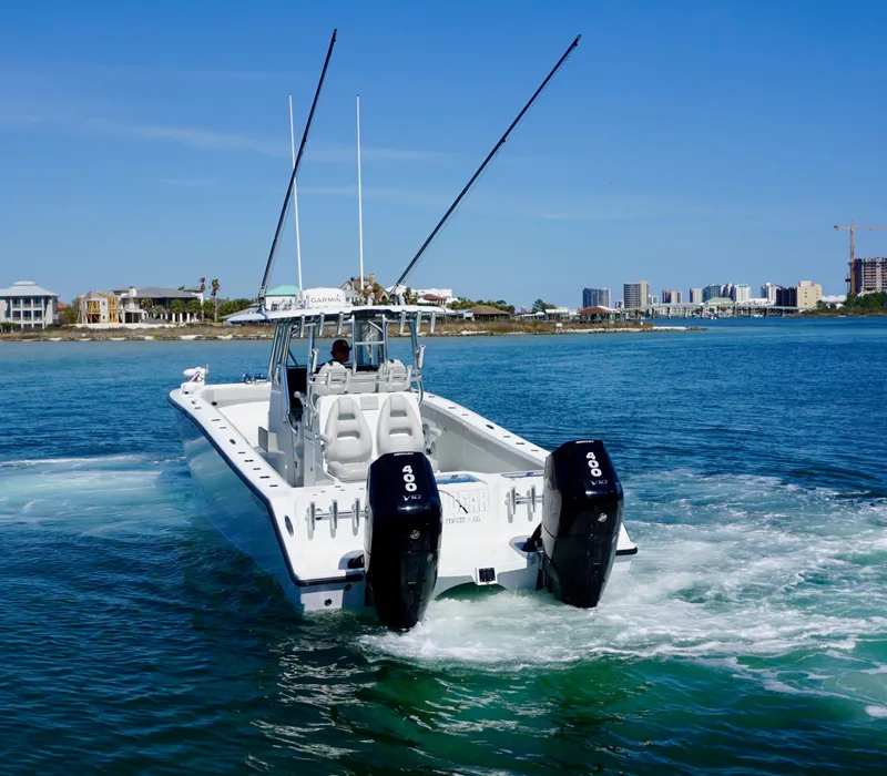 Slide: The Image of Freeman VH 2020 boat cruising on blue water near coastal cityscape. - 7