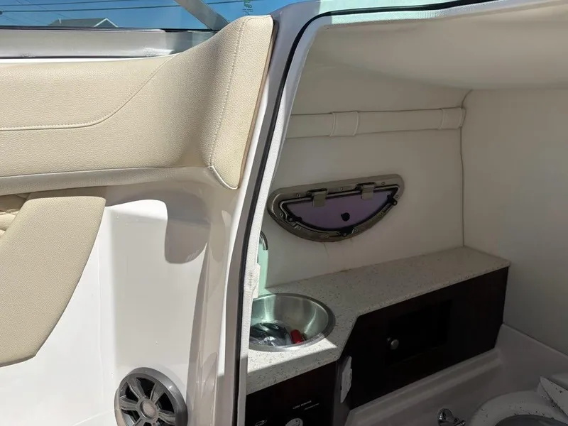 Slide: The Image of 2018 Regal 26 OBX boat interior with sink and storage area. - 13