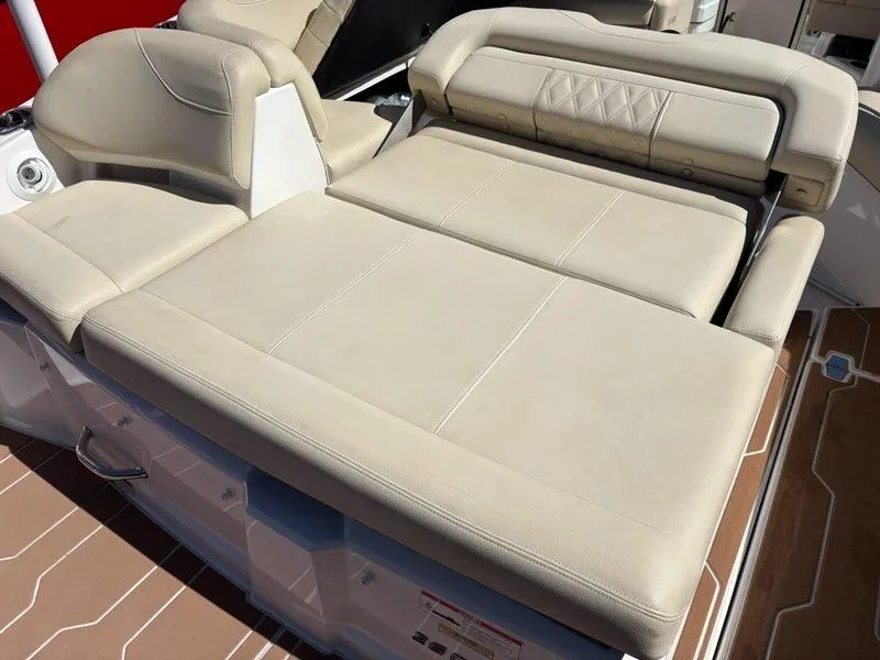 Slide: The Image of 2018 Regal 26 OBX boat with beige cushioned seating area. - 5