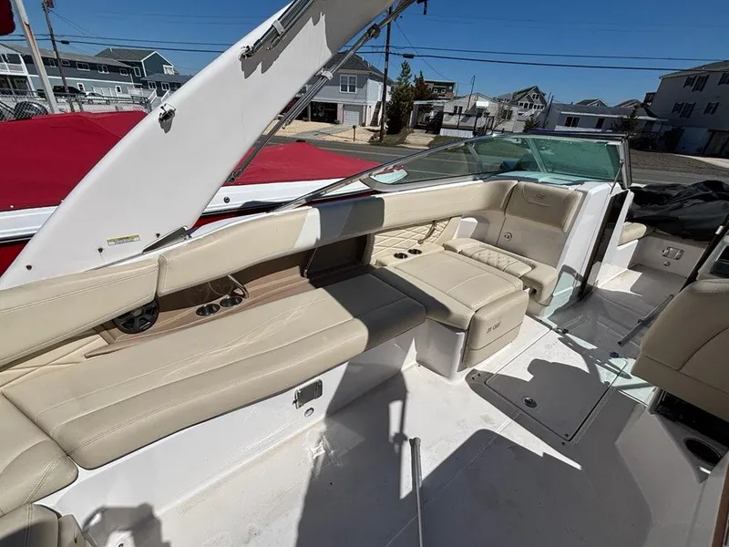 Slide: The Image of 2018 Regal 26 OBX boat interior with beige seating and modern design. - 8