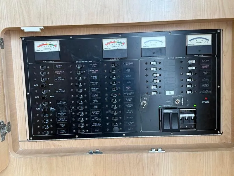 Slide: The Image of Electrical control panel on a 2005 Out Island 38 Express Fisherman boat. - 16