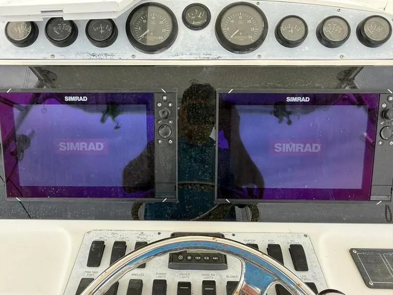 Slide: The Image of Control panel of a 2005 Out Island 38 Express Fisherman with Simrad displays. - 21