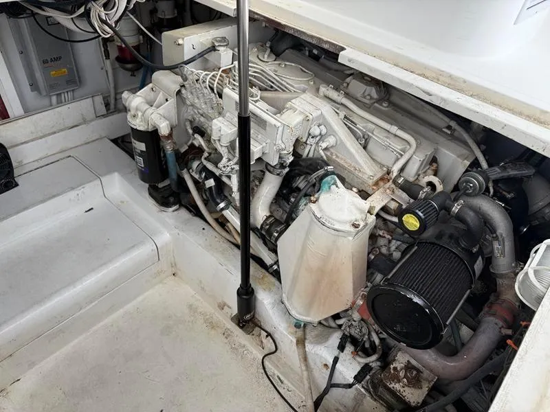 Slide: The Image of Engine compartment of a 2005 Out Island 38 Express Fisherman boat. - 24