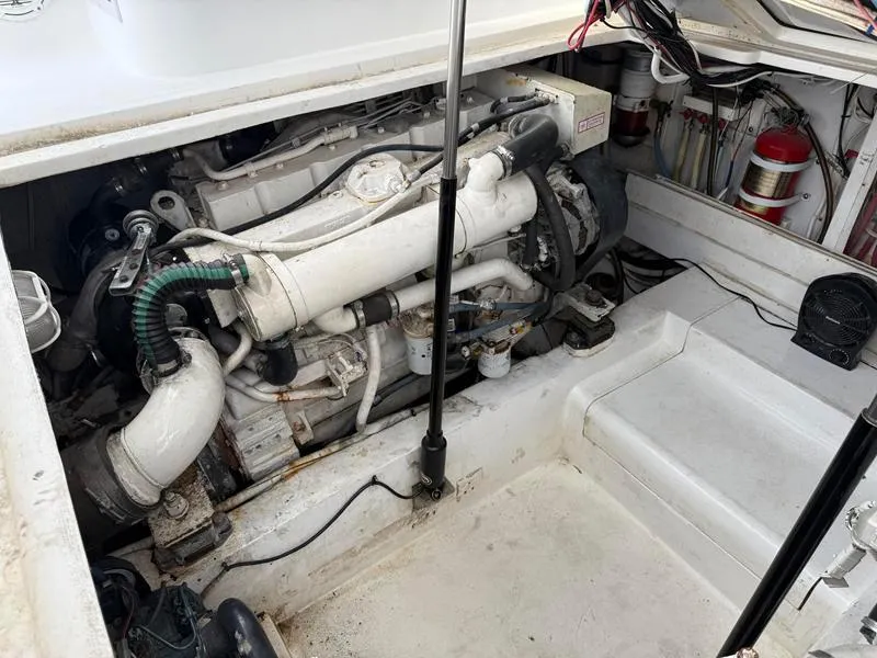 Slide: The Image of Engine compartment of a 2005 Out Island 38 Express Fisherman boat. - 25