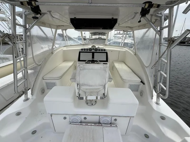Slide: The Image of 2005 Out Island 38 Express Fisherman boat interior with helm and seating area. - 5