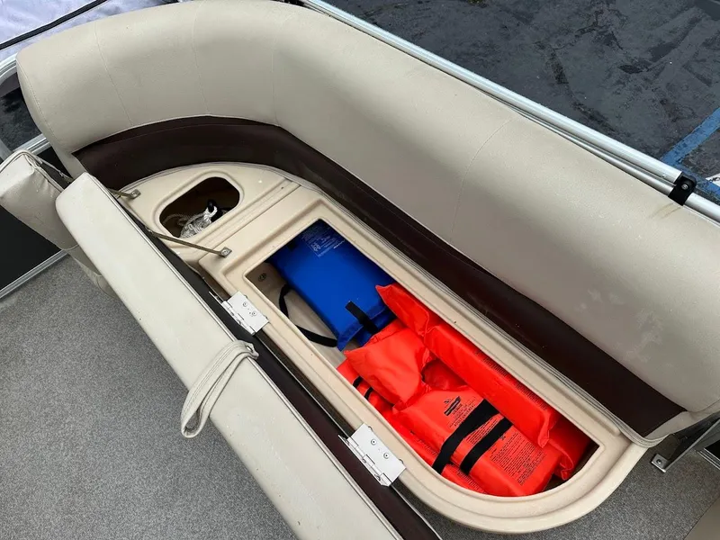 Slide: The Image of 2019 Sun Tracker Party Barge 18 DLX seat storage with life jackets. - 14