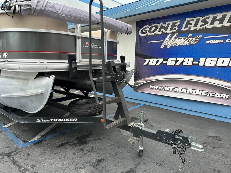 Slide: The Image of 2019 Sun Tracker Party Barge 18 DLX on trailer at GF Marine dealership. - 3