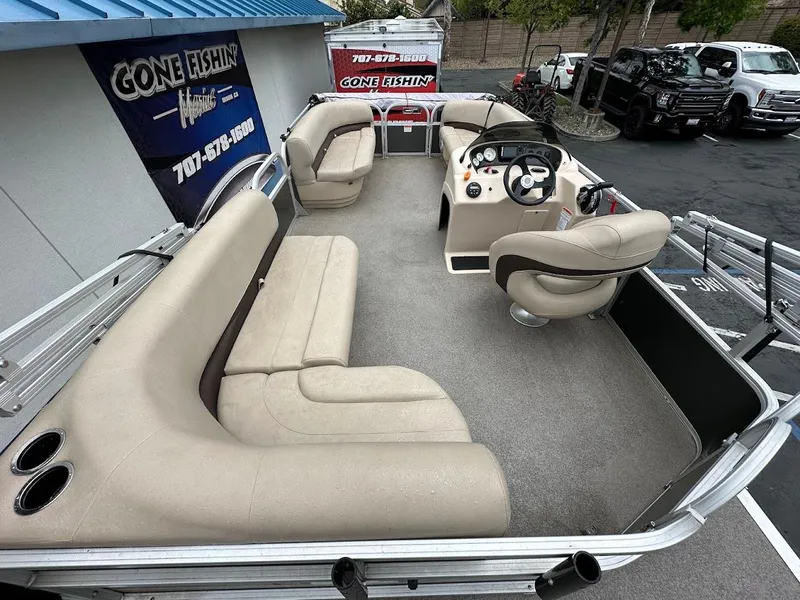 Slide: The Image of 2019 Sun Tracker Party Barge 18 DLX with spacious seating and modern helm. - 6
