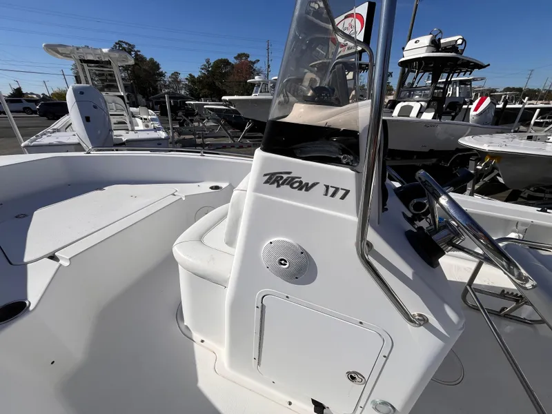 Slide: The Image of 2010 Sea Hunt Triton 177 boat interior with steering console and seating. - 11