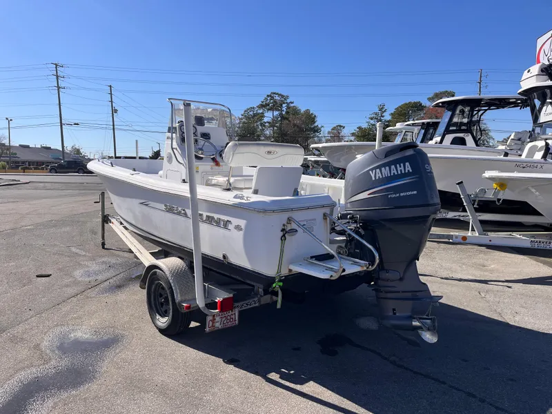 Slide: The Image of 2010 Sea Hunt Triton 177 boat with Yamaha outboard motor on a trailer. - 3