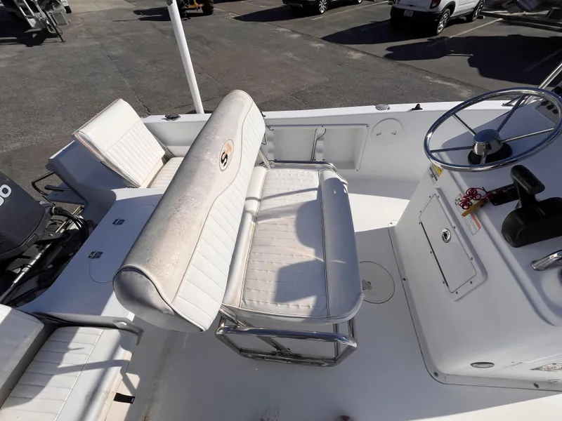 Slide: The Image of 2010 Sea Hunt Triton 177 boat interior with seating and steering wheel. - 7