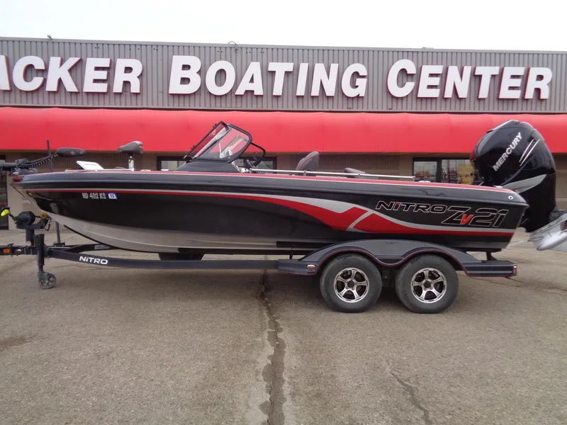 Slide: The Image of 2018 Nitro ZV21 boat on trailer at boating center. - 0