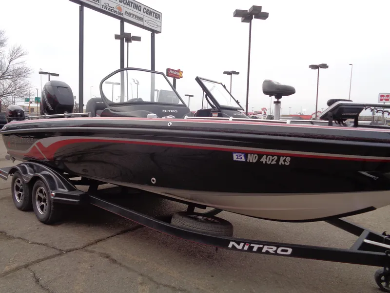 Slide: The Image of 2018 Nitro ZV21 boat on trailer in parking lot. - 4