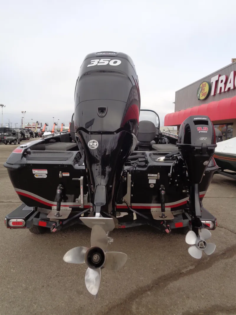 Slide: The Image of 2018 Nitro ZV21 boat with dual outboard motors, displayed at a dealership. - 5