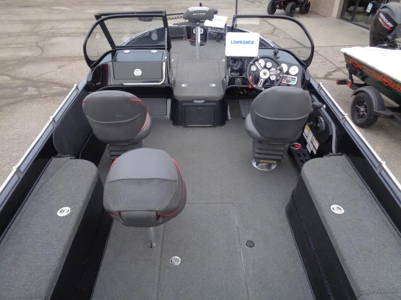 Slide: The Image of 2018 Nitro ZV21 boat interior with seating, steering console, and Lowrance equipment. - 6