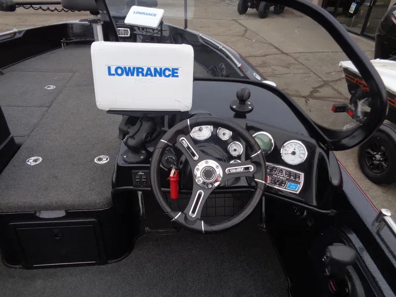 Slide: The Image of Nitro ZV21 2018 boat dashboard with Lowrance navigation system and steering wheel. - 7