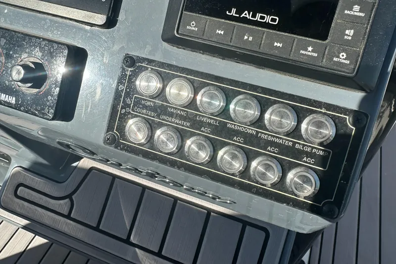Slide: The Image of Control panel of 2023 Tidewater 2700 Carolina Bay boat with JL Audio system. - 26