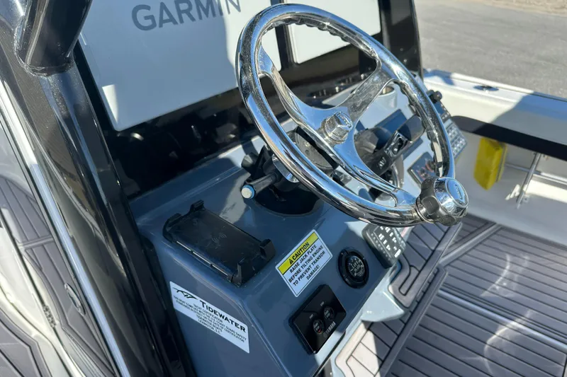 Slide: The Image of 2023 Tidewater 2700 Carolina Bay steering console with Garmin navigation system. - 32
