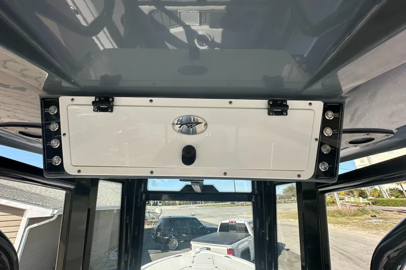 Slide: The Image of 2023 Tidewater 2700 Carolina Bay boat console with storage compartment and overhead view. - 35