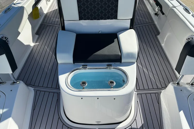 Slide: The Image of 2023 Tidewater 2700 Carolina Bay boat interior with seating and livewell. - 43