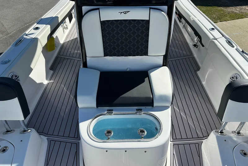 Slide: The Image of 2023 Tidewater 2700 Carolina Bay boat interior with seating and livewell. - 44