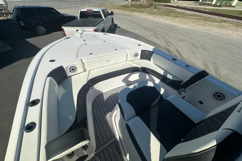 Slide: The Image of 2023 Tidewater 2700 Carolina Bay boat interior with seating and speakers. - 47