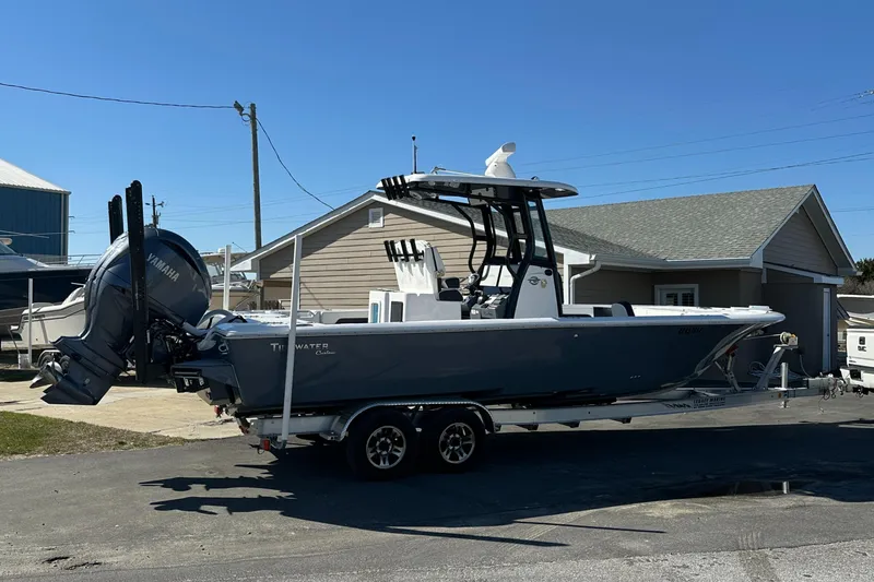 Slide: The Image of 2023 Tidewater 2700 Carolina Bay boat on trailer, parked outdoors. - 7