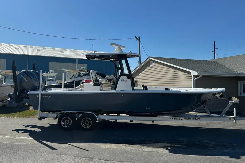 Slide: The Image of 2023 Tidewater 2700 Carolina Bay boat on trailer, parked outdoors. - 8