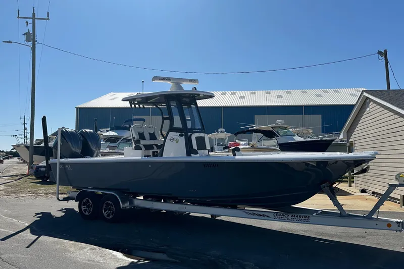 Slide: The Image of 2023 Tidewater 2700 Carolina Bay boat on trailer, parked outdoors. - 9