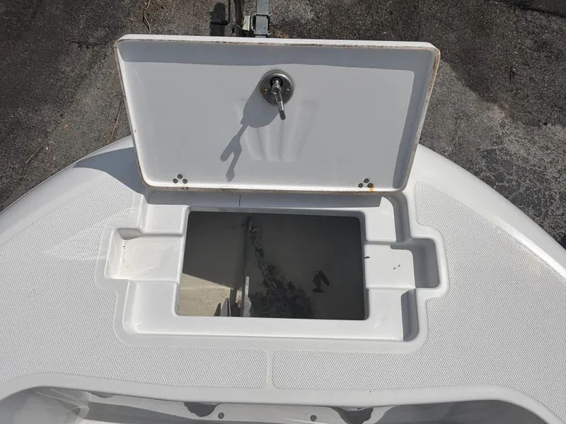 Slide: The Image of Open storage compartment on 2022 Wellcraft 202 Fisherman boat. - 13