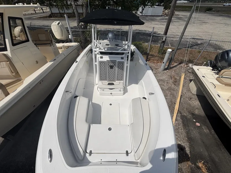 Slide: The Image of 2022 Wellcraft 202 Fisherman boat with center console and seating, docked outdoors. - 14