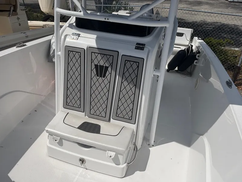 Slide: The Image of 2022 Wellcraft 202 Fisherman boat interior with seating and storage compartments. - 9