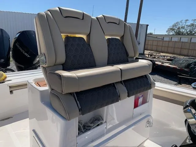 Slide: The Image of 2019 Tidewater 2700 Carolina Custom Bay boat seats, featuring beige and black upholstery. - 8