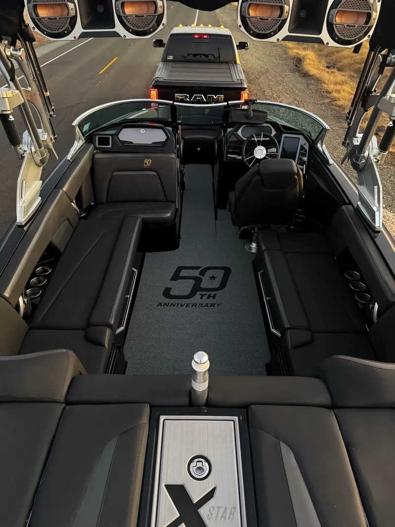 Slide: The Image of 2018 MasterCraft XStar interior with luxurious seating and 50th anniversary logo. - 8