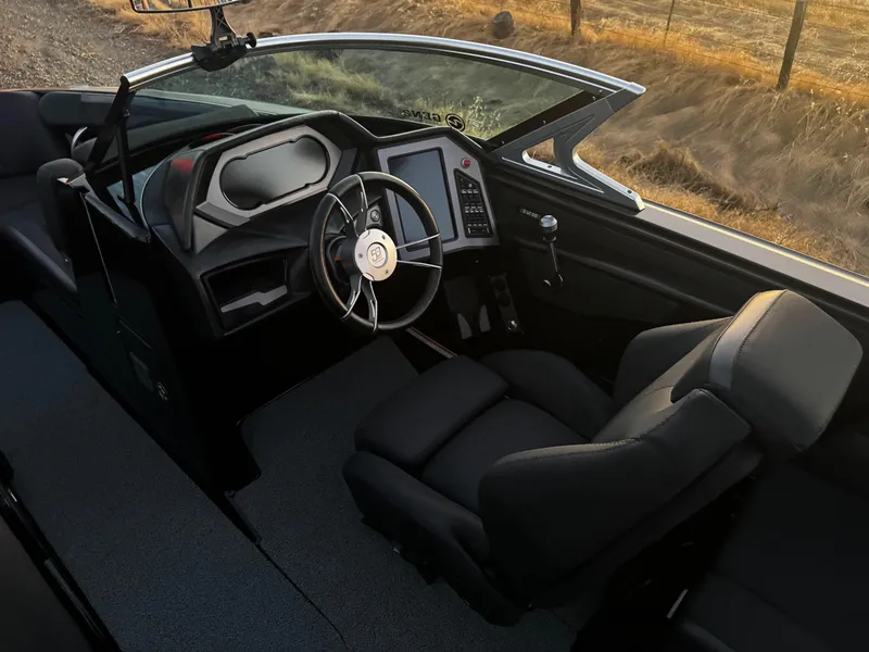 Slide: The Image of 2018 MasterCraft XStar boat interior with modern dashboard and steering wheel. - 9