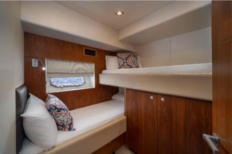 Slide: The Image of Cabin interior of 2011 Sunseeker 64 Predator yacht with bunk beds and wooden finish. - 15